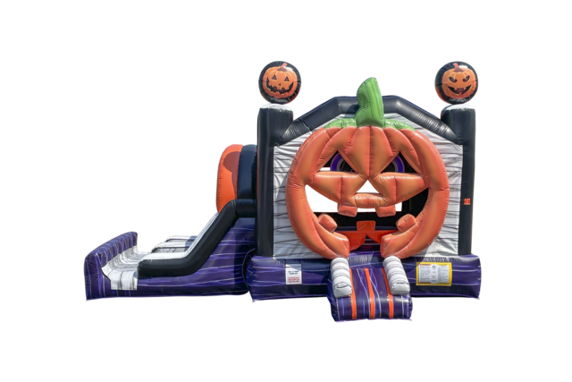 Inflatable pumpkin-shaped bounce house with a slide, predominantly orange with Halloween-themed decorations.