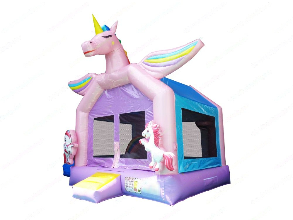 Inflatable bounce house with a rainbow unicorn theme, featuring a large pink unicorn at the top and colorful rainbows.